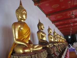 Gold Sitting Buddhas - the king collected these from all over Thailand and brought to main temple for protection and display