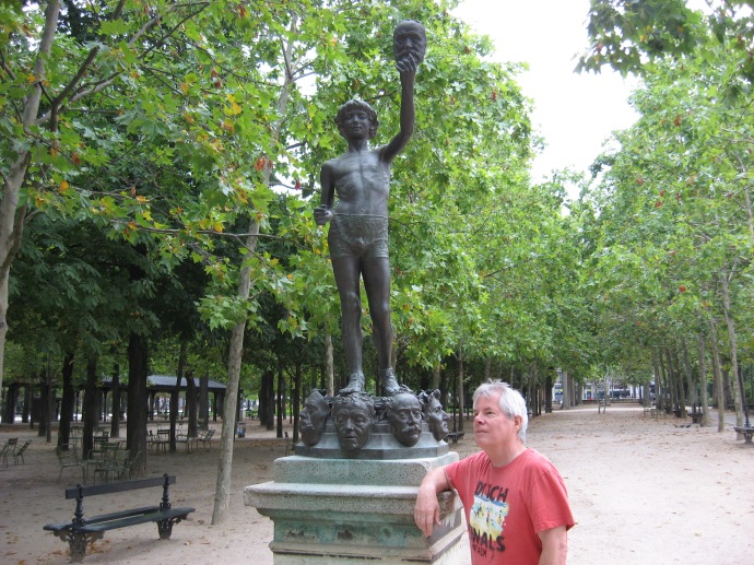 Me posing next to my favorite statue in Paris - the mask seller in the Jardin de Luxembourg