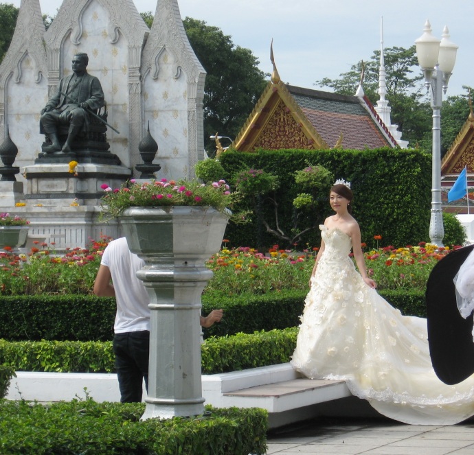 I stumbled upon this bride posing for her wedding pictures at the Wat Ratchanatdaram Worawihan temple