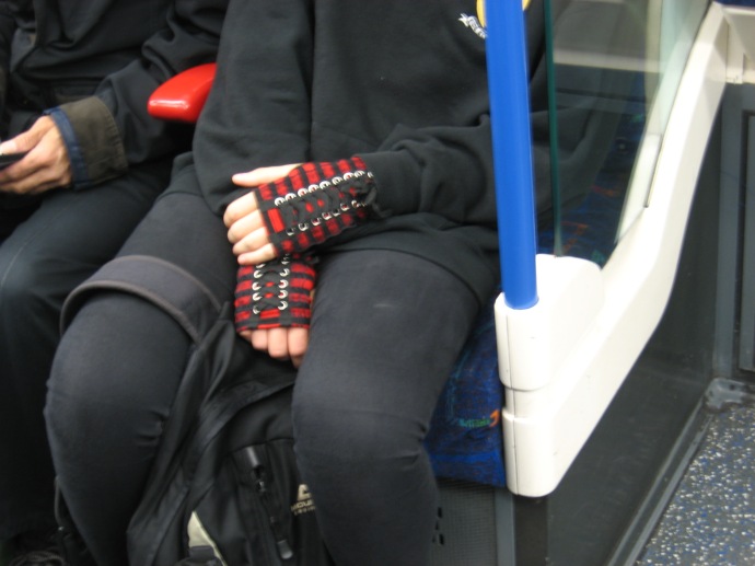 Hand shoes a girl was wearing on the Underground