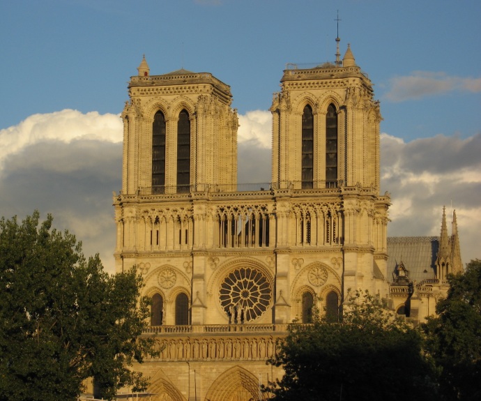 Notre Dame Cathedral at the city's heart - evening light turning it a butter color - construction started in 1163 - finished 200 years later. Wonderful stain glass windows.